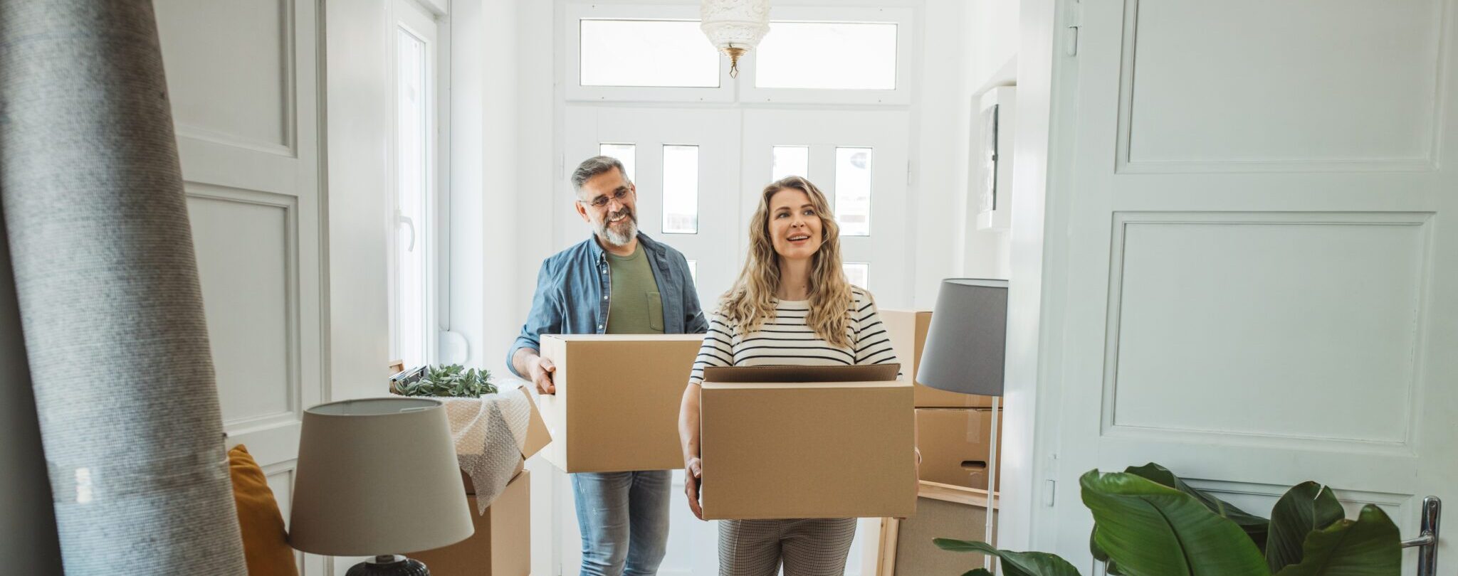 Mature Couple with Moving Boxes in New Home