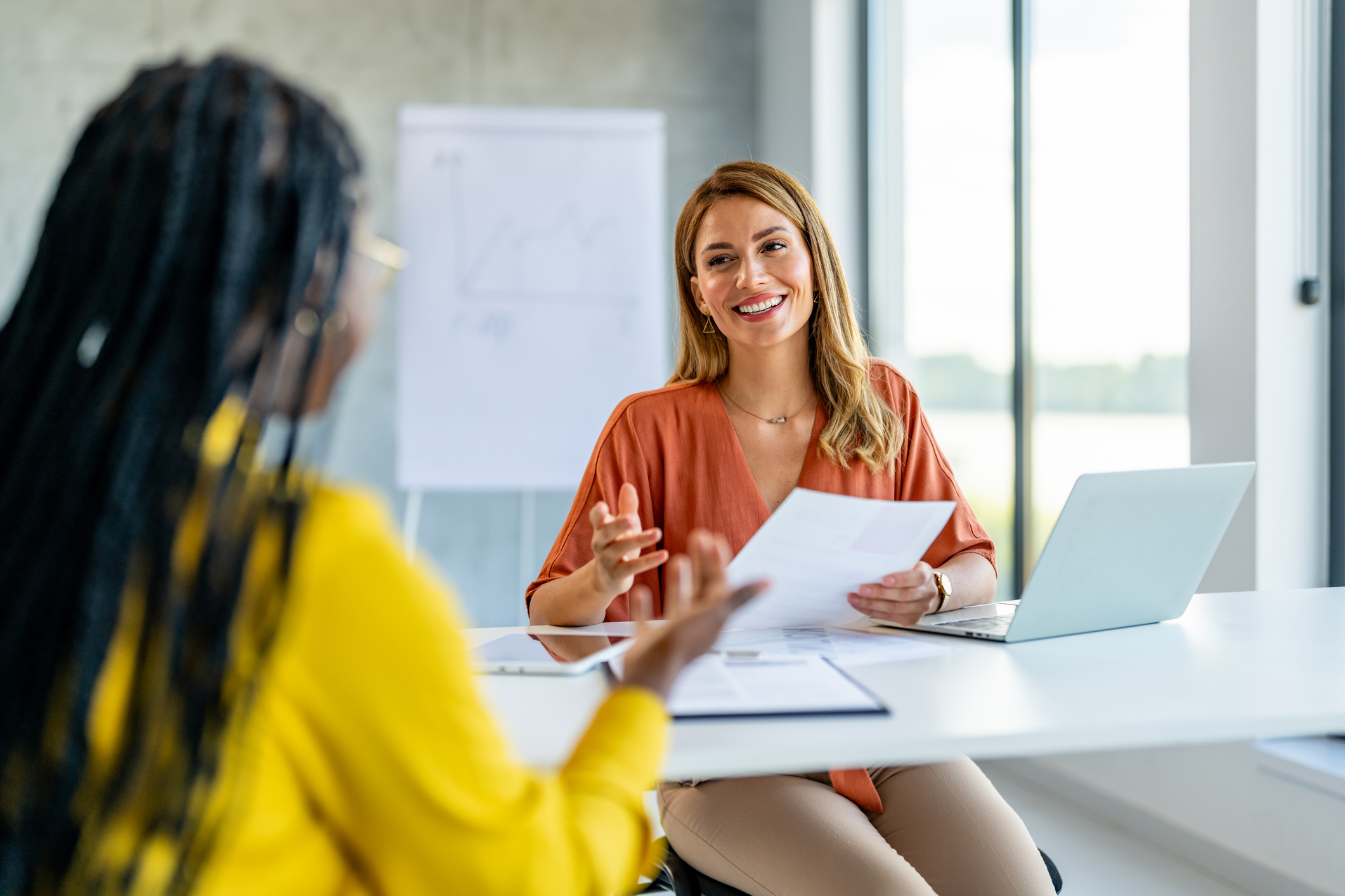 Businesswoman Interviewing Female Job candidate In The Office Meeting Room