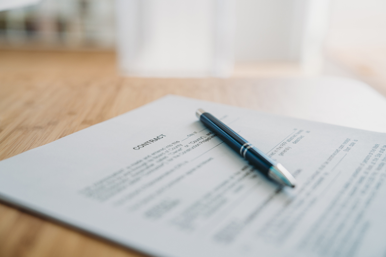 Contract on the desk with a pen
