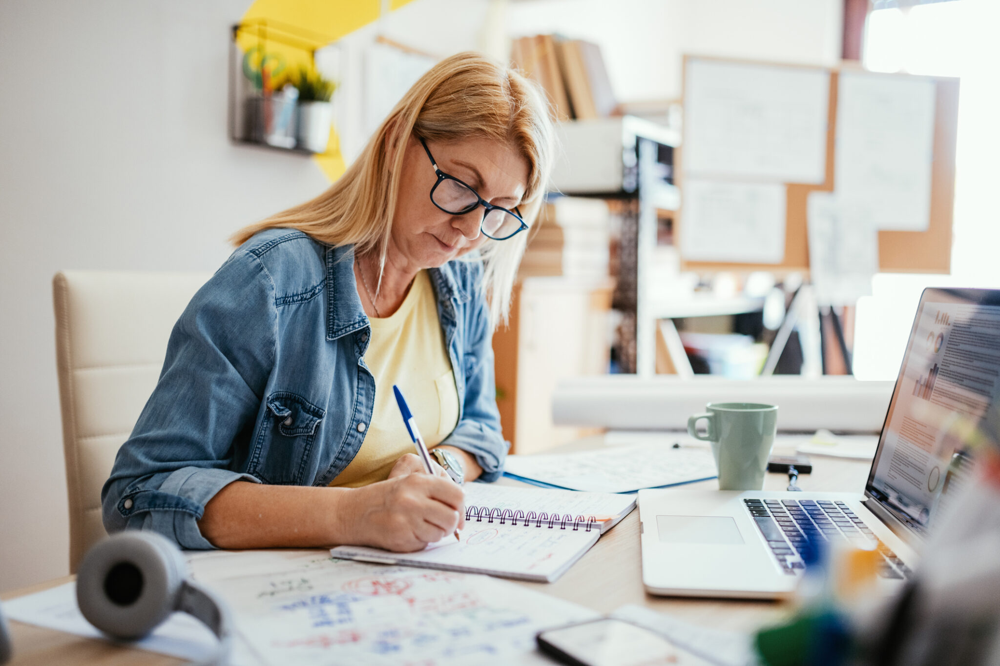 Mature woman filling tax documents online