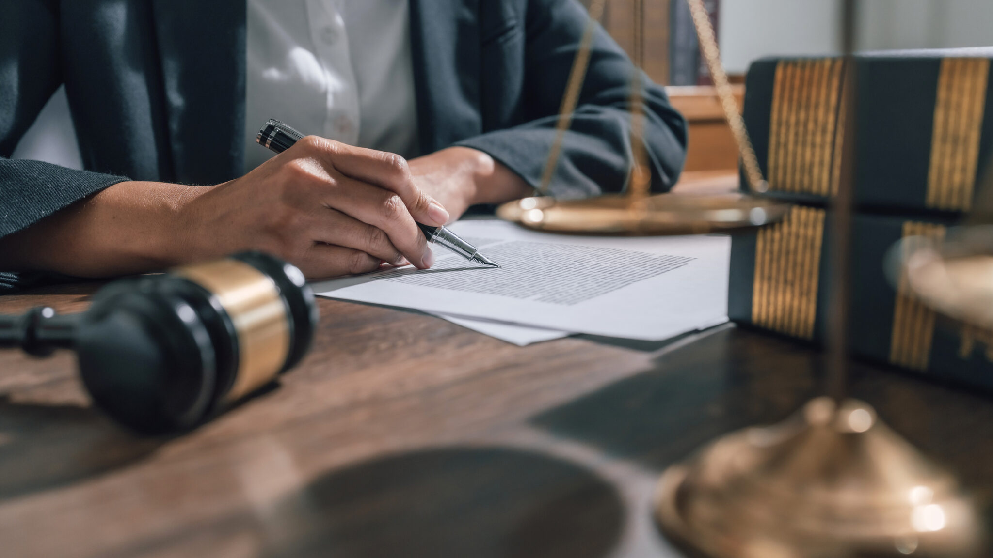 lawyer or judge counselor reading legal contract documents in office.